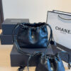 Chanel black gold drawstring handbag